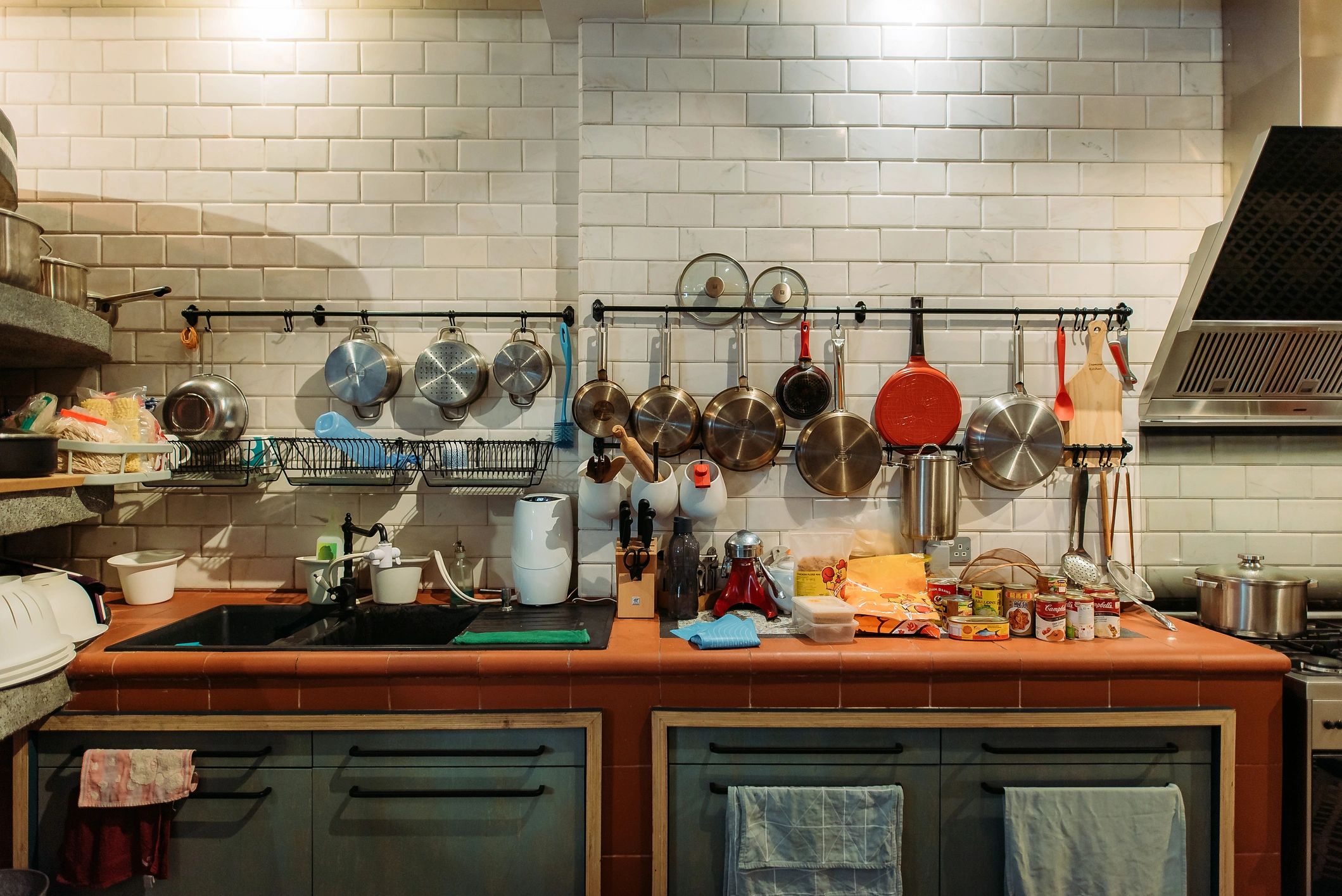 Warm kitchen counter with cooking utensils and ingredients